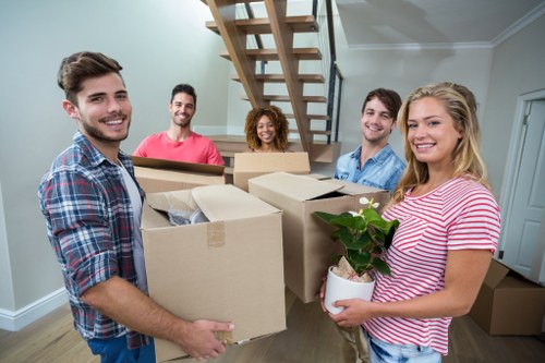 Harrow Movers team loading furniture safely with protective wrapping
