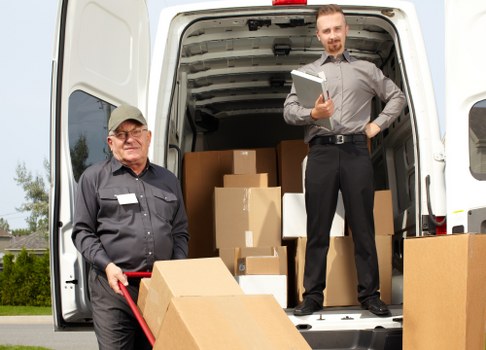 Local movers transporting boxes and household items in Harrow