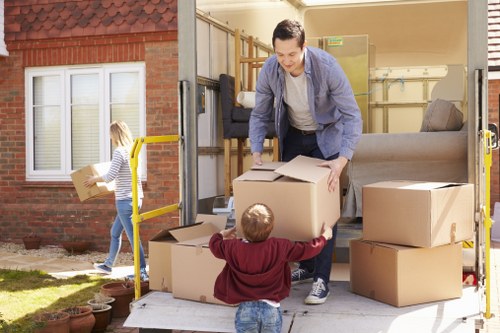 Removal van and moving boxes in a Harrow residential street