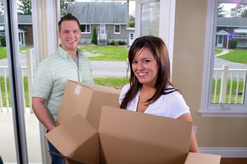 Removal staff handling furniture with care during relocation