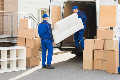 Packed office boxes and furniture prepared for transport