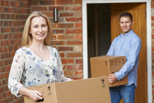 Professional Harrow moving team loading furniture
