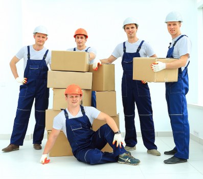 Local removals team loading items for a flat or house move in Harrow