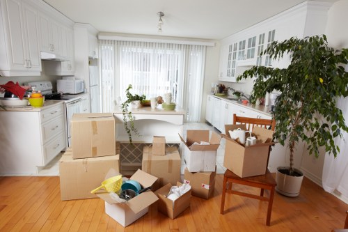 Packed boxes and furniture loaded into a van for transport