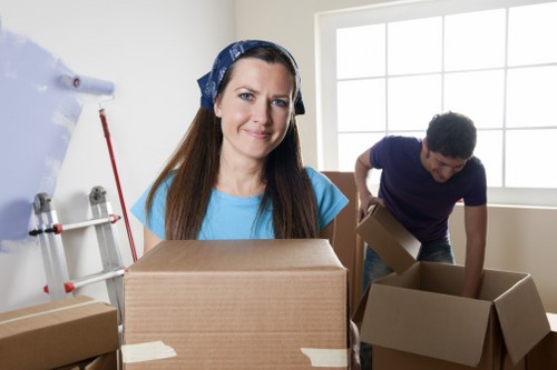 Moving crew transporting business items in Harrow streets