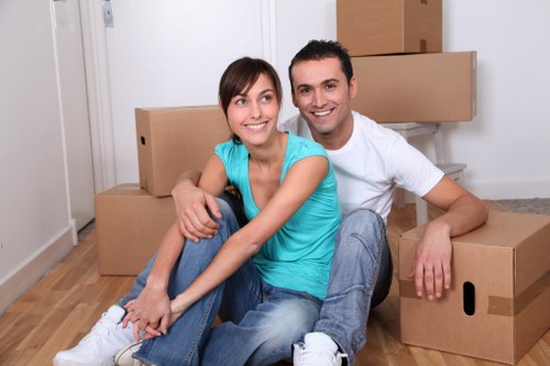 Packed student belongings and furniture ready for transport in Harrow