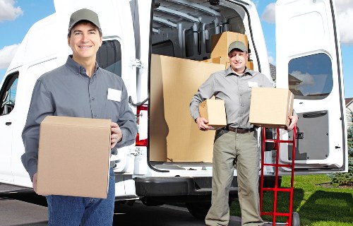 Packed boxes and furniture prepared for apartment removals in Harrow