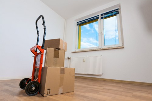 Professional movers handling desks and equipment in Harrow