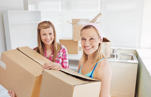 Packed boxes and furniture ready for urgent removals in Harrow