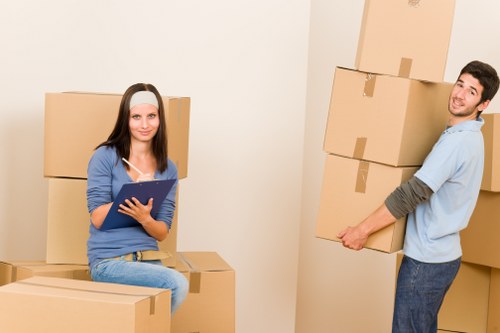 Office relocation preparation in Harrow with desks and boxes